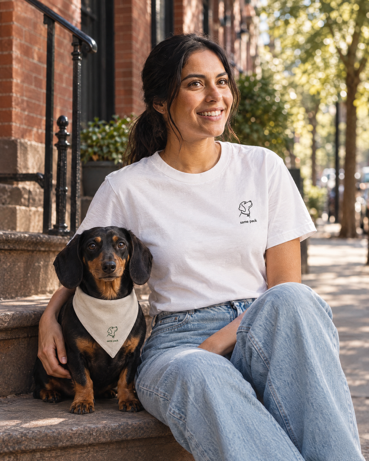 Woman wearing The Minimal Tee White with her dachshund in The Pack Bandana Stone